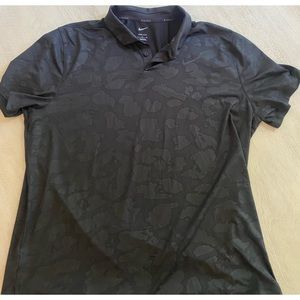 Nike golf polo. Never worn!   Brand new.  Black with design